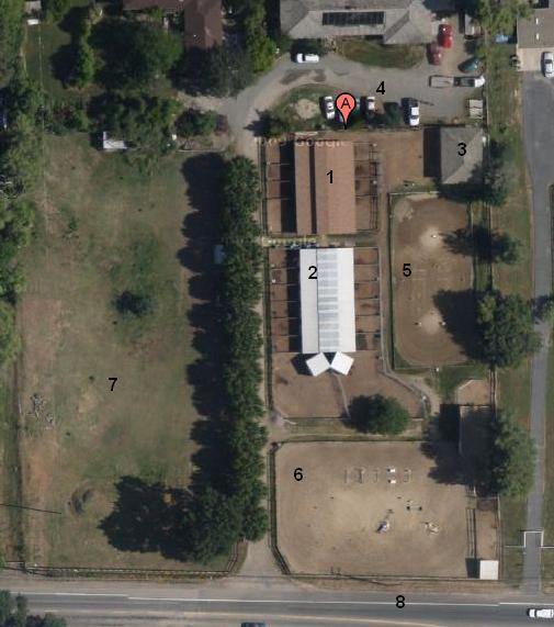 Aerial map of KPStables with numbered barns, arenas, pasture, and driveway.